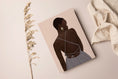 Load image into Gallery viewer, Artwork featuring Elana, a black woman in a sleeveless mauve dress, looking over her shoulder in a simple and sophisticated scene.
