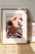Load image into Gallery viewer, Artwork featuring Tula, a strong black woman in a floral dress, with a serene purple leaves background and the quote "Stronger than Yesterday."
