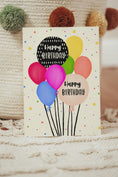 Load image into Gallery viewer, Fun and vibrant birthday card with hand-drawn balloons, stars, and flowers on a 4.2 x 5.5 inch card.