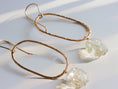 Load image into Gallery viewer, Oval citrine dangle earrings worn, featuring gold filled wire and raw gemstone detail