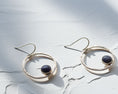 Load image into Gallery viewer, Handmade sterling silver earrings with sodalite gemstone on textured white background