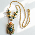 Load image into Gallery viewer, Full handmade statement necklace with wire woven brass pendant, red aventurine, dark green jade, jade bead chain and brass accents, flat lay by bykjones NC jewelry artist