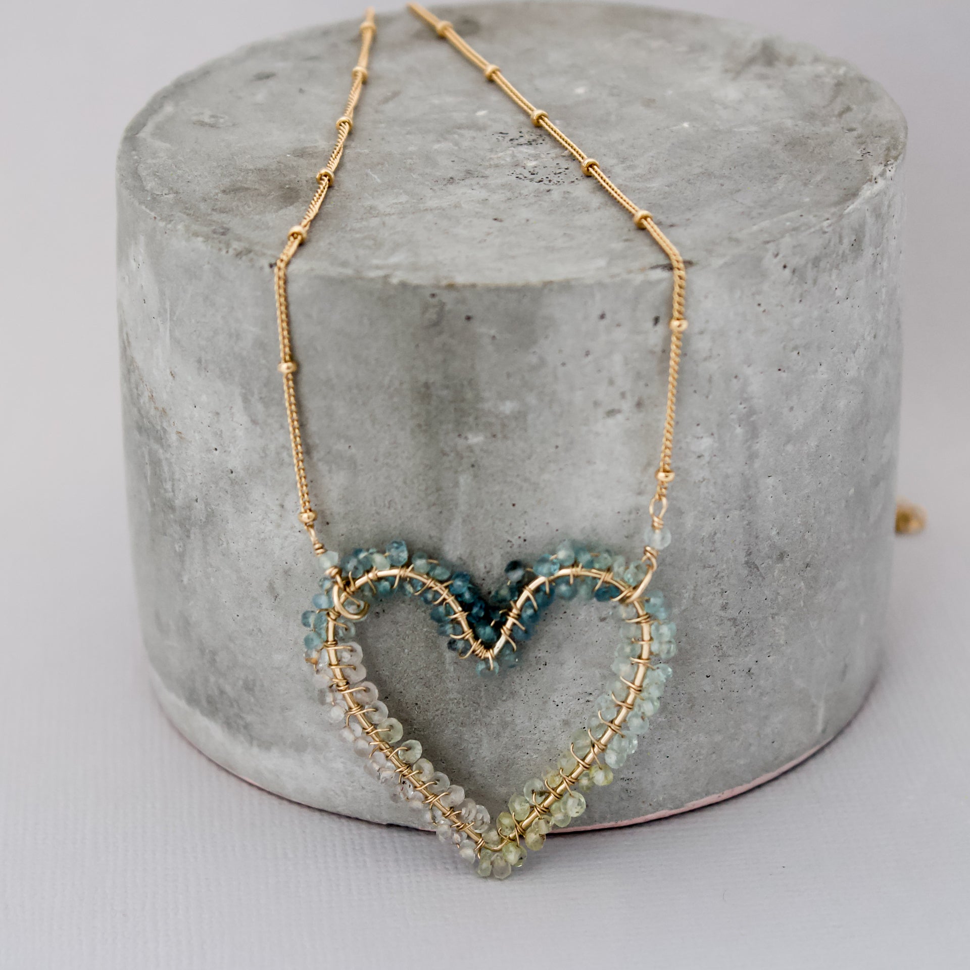 gold heart pendant, blue gemstone, statement gemstone necklace