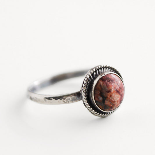Handmade sterling silver ring with round jasper gemstone, hammered band, and rope bezel, size 8.