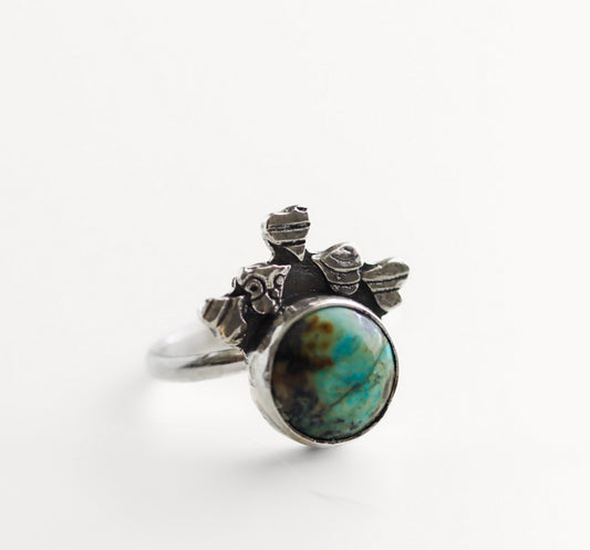 Hand-forged sterling silver statement ring with stamped hearts and oval African Turquoise gemstone, size 7.