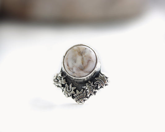 Hand-forged sterling silver ring with round Brazilian agate and starburst-stamped embellishments, size 7.
