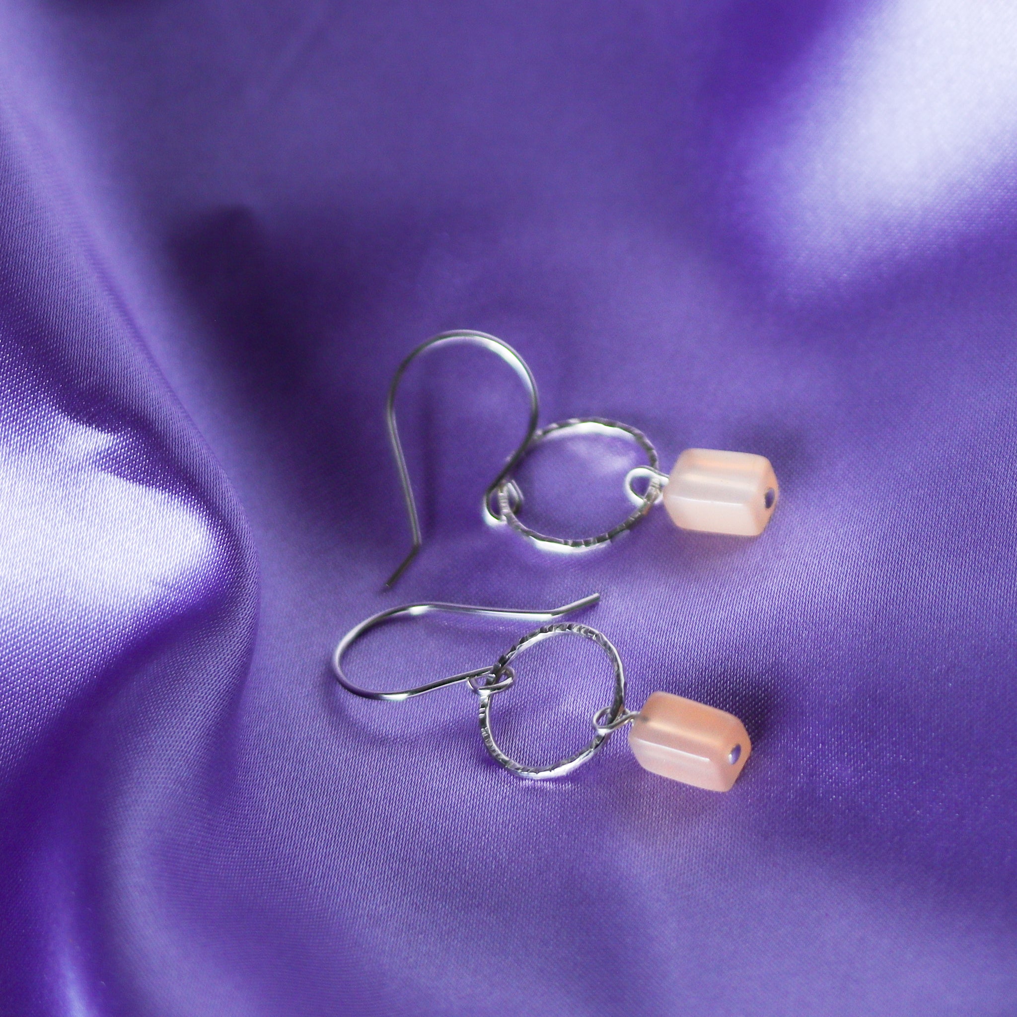 Lightweight minimalist sterling silver earrings featuring ethically sourced peach moonstone.