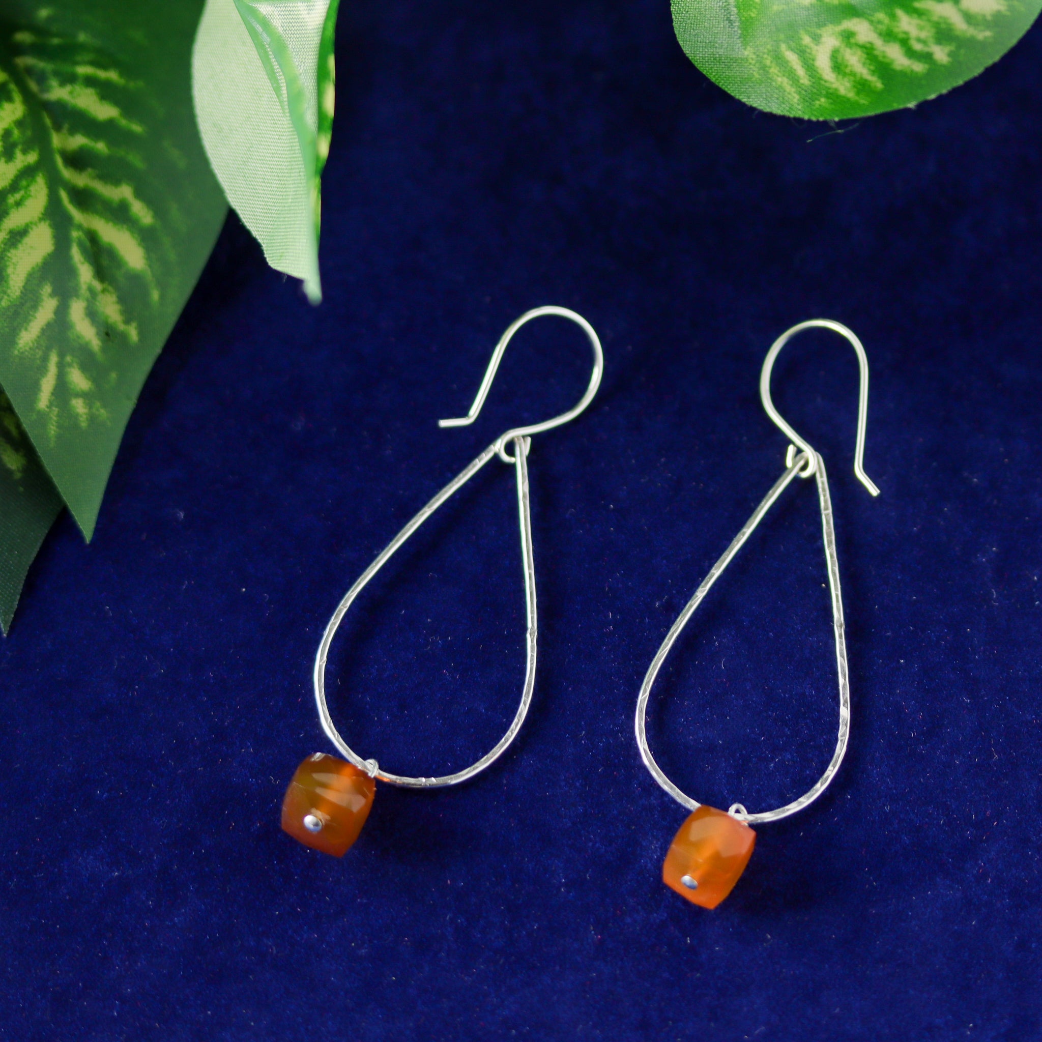 Lightweight sterling silver earrings featuring natural cognac chalcedony gemstones.