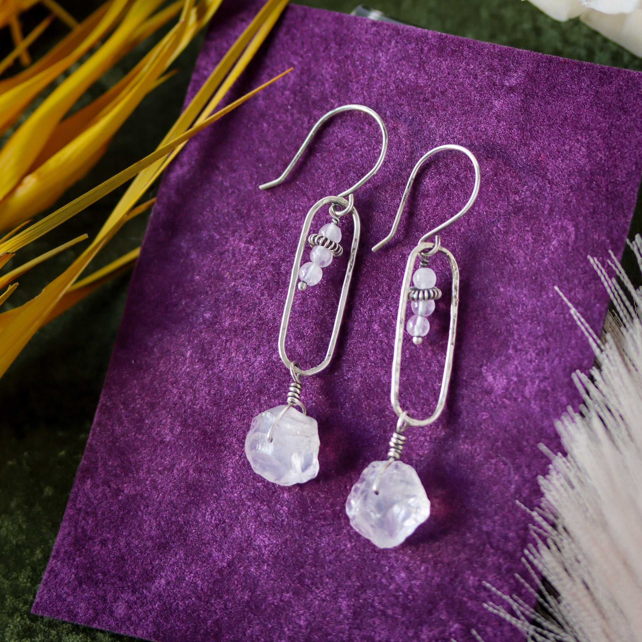 Handmade sterling silver earrings featuring pink quartz gemstones in a minimalist drop dangle design