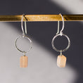 Load image into Gallery viewer, Close-up of 925 sterling silver earrings with natural peach moonstone gemstones in a drop dangle style.
