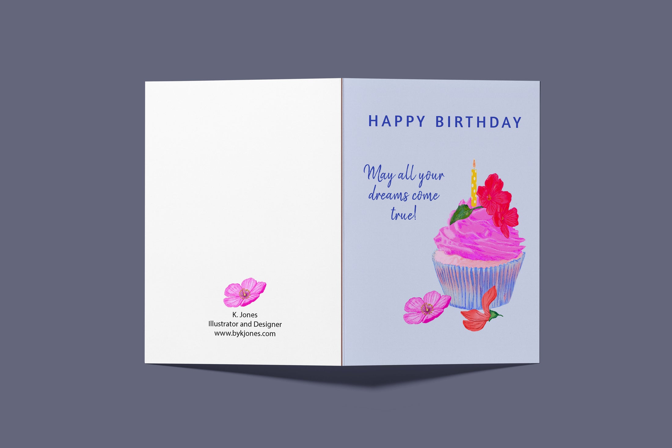  Illustrated feminine birthday card with a cupcake featuring hot pink icing, a flower, and a candle on a light blue background
