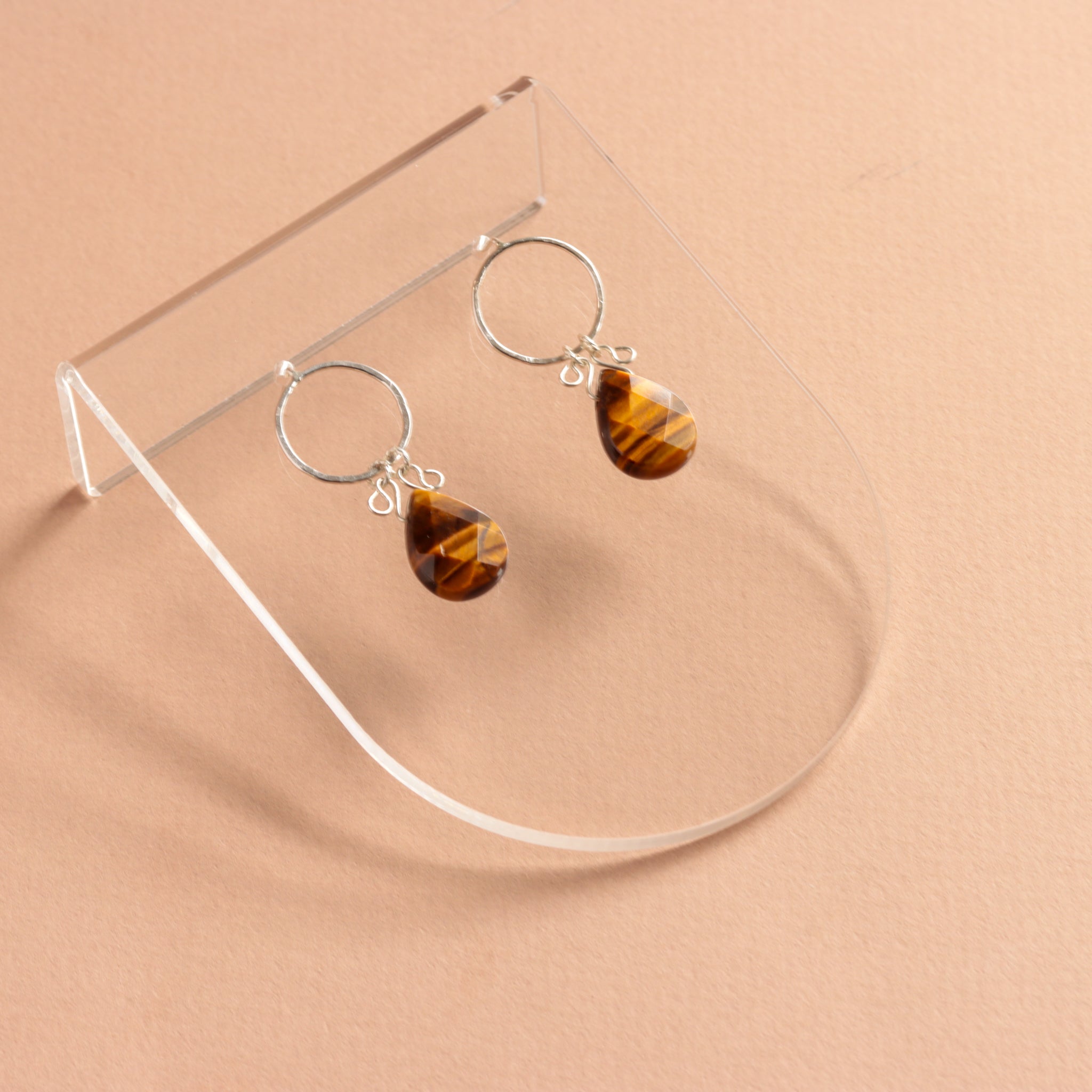 Delicate sterling silver earrings featuring tiger eye gemstones