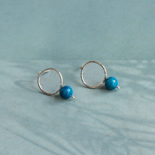 Delicate sterling silver earrings featuring blue jade stones