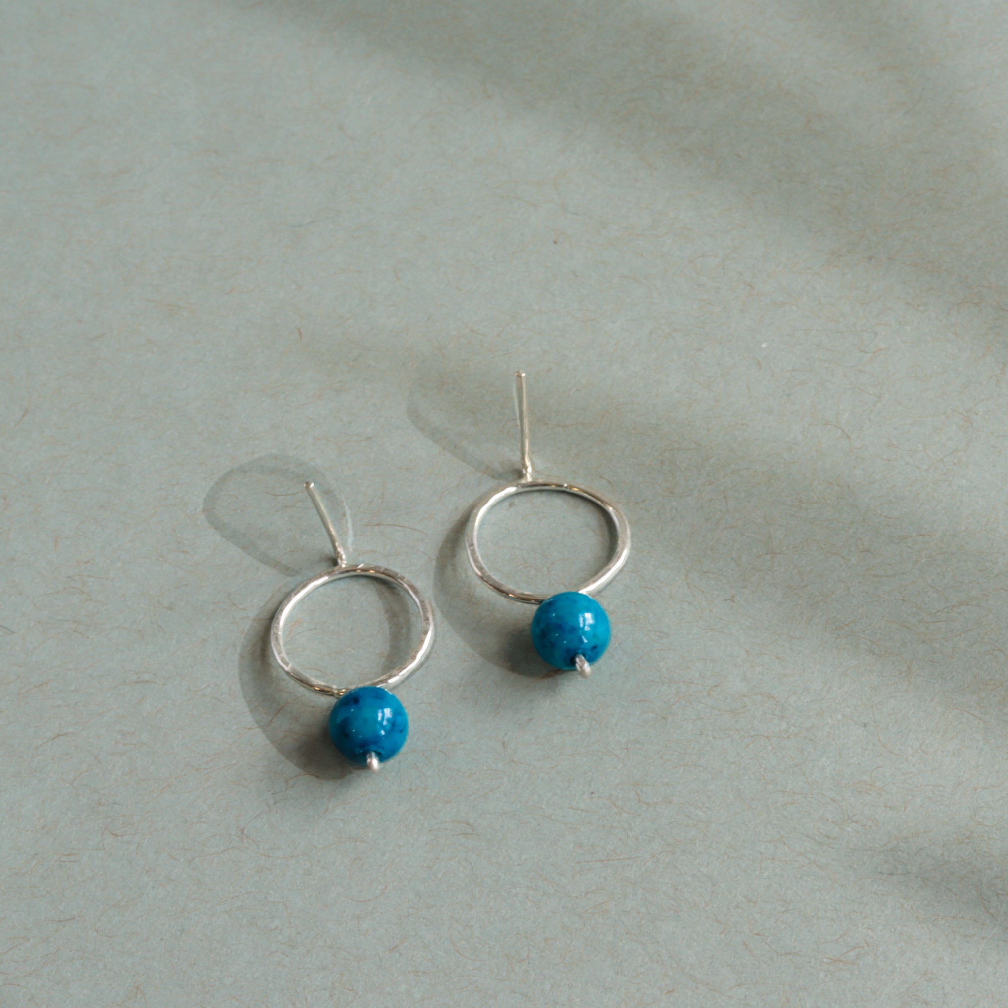 Unique sterling silver earrings with blue jade gemstones