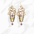 Load image into Gallery viewer, Brass chandelier earrings with sculptural wire work, amethyst, and turquoise — handmade by bykjones
