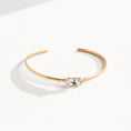 Load image into Gallery viewer, Handmade brass cuff bracelet with centered Swarovski clear crystal, photographed flat lay on white linen background, made by bykjones NC jewelry artist bykjones.jpg
