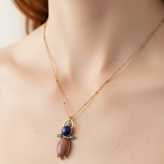 Handmade gemstone pendant necklace with rhodonite lapis and Swarovski crystals worn at collarbone on 18k gold satellite chain, bykjones NC jewelry