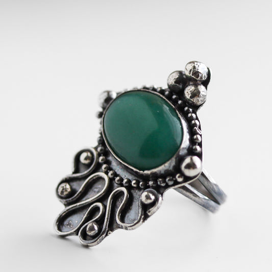Boho-minimalist sterling silver ring with vibrant green aventurine cabochon in detailed artisan setting