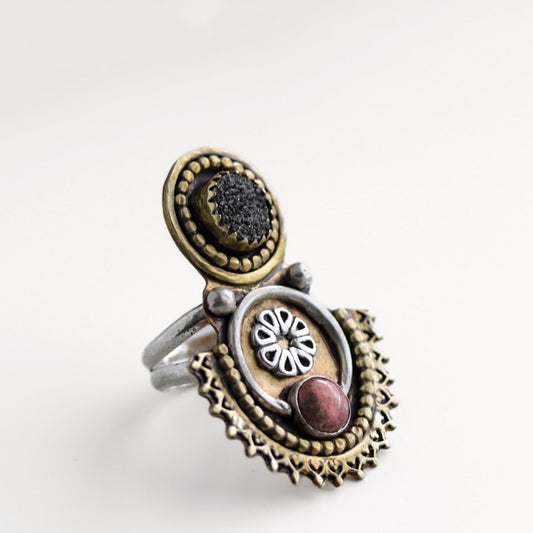 Hand-forged brass and sterling silver statement ring featuring red jasper and black druzy agate on a textured mixed metal band, size 7.