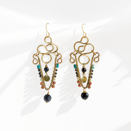 Brass chandelier earrings with sculptural wire work, onyx, turquoise, white howlite, and jasper stones — handmade by bykjones