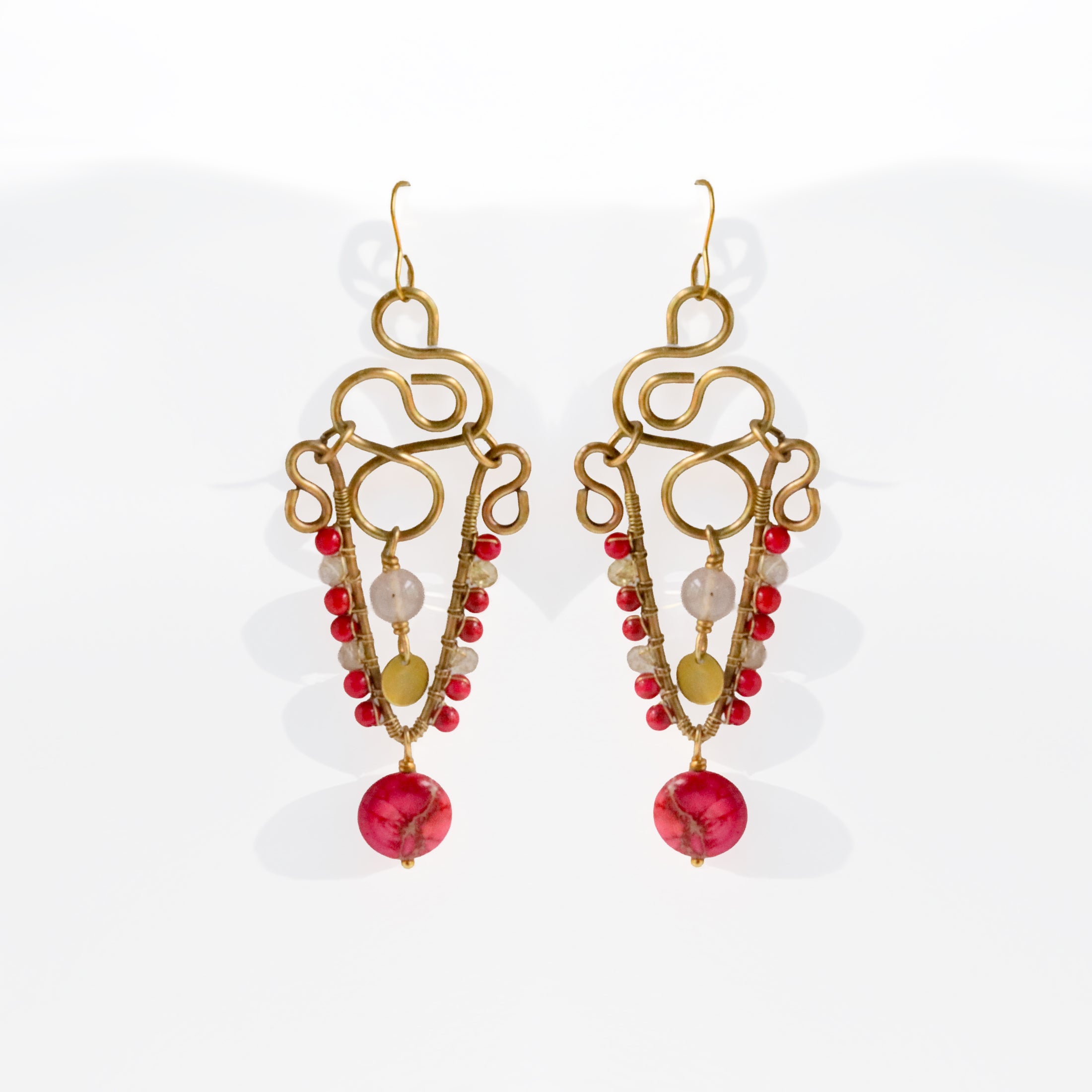 Brass chandelier earrings with sculptural wire work, pink impression jasper, and crystal quartz — handmade by bykjones