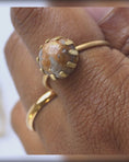 Load and play video in Gallery viewer, Fancy jasper brass statement ring handmade, orange, and grey stone, rotating on finger, adjustable brass prong ring, bykjones
