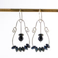 Load image into Gallery viewer, Handmade large sterling silver hoop earrings with dark blue Dumortierite gemstones, 2.5 inches long, perfect for a bold, bohemian look.
