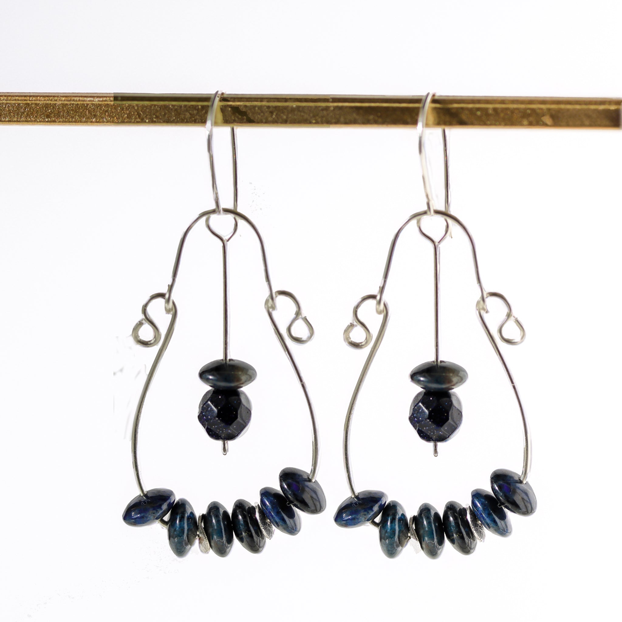 Handmade large sterling silver hoop earrings with dark blue Dumortierite gemstones, 2.5 inches long, perfect for a bold, bohemian look.