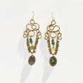 Load image into Gallery viewer, Brass chandelier earrings with sculptural wire work, teal impression jasper, and pyrite — handmade by bykjones

