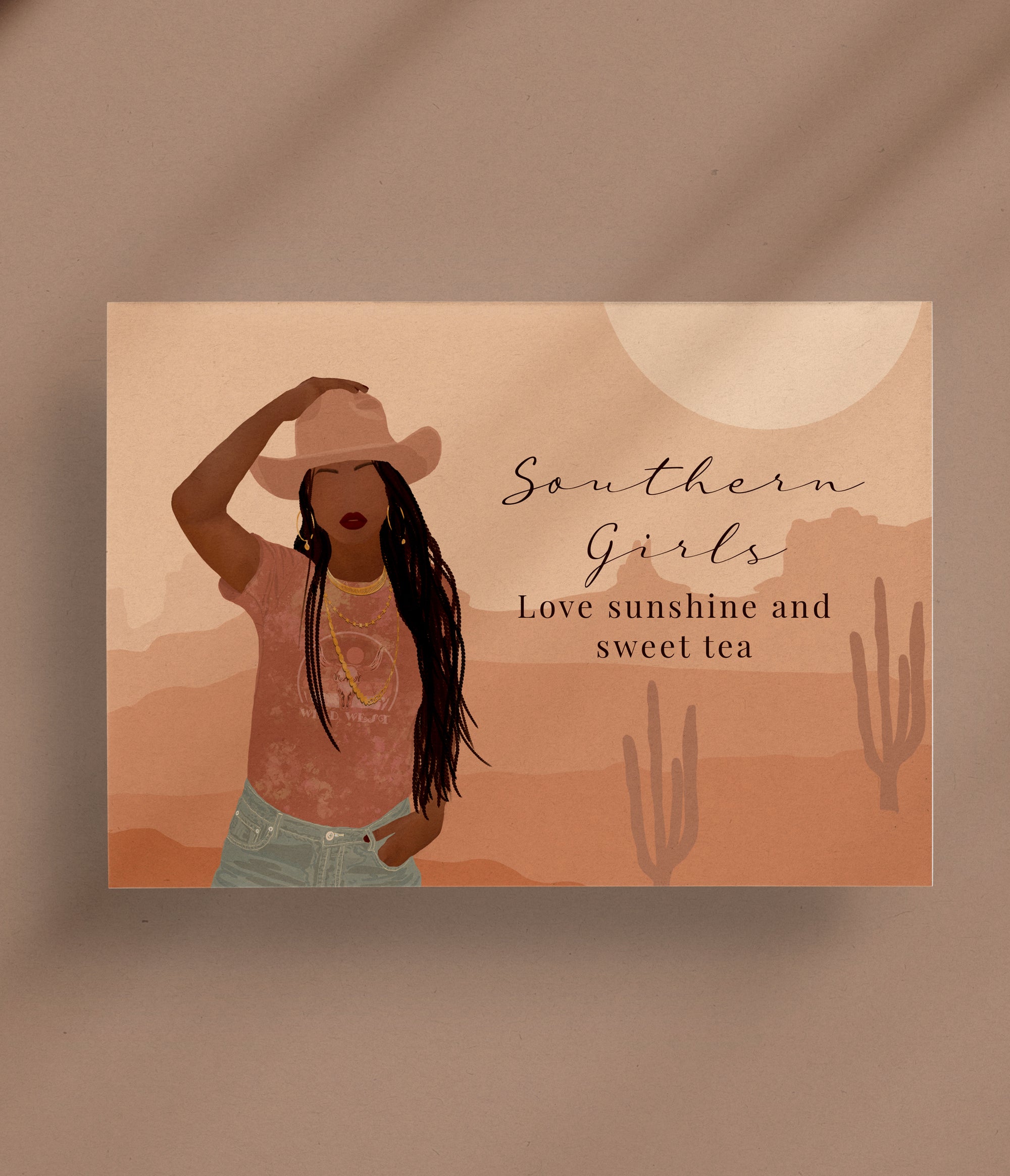 Close-up of a greeting card featuring a stylish southern girl in a cowgirl hat with long braids, surrounded by a sunny design and the text "Southern Girls Love Sunshine and Sweet Tea