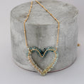 Load image into Gallery viewer, gold heart pendant, blue gemstone, statement gemstone necklace
